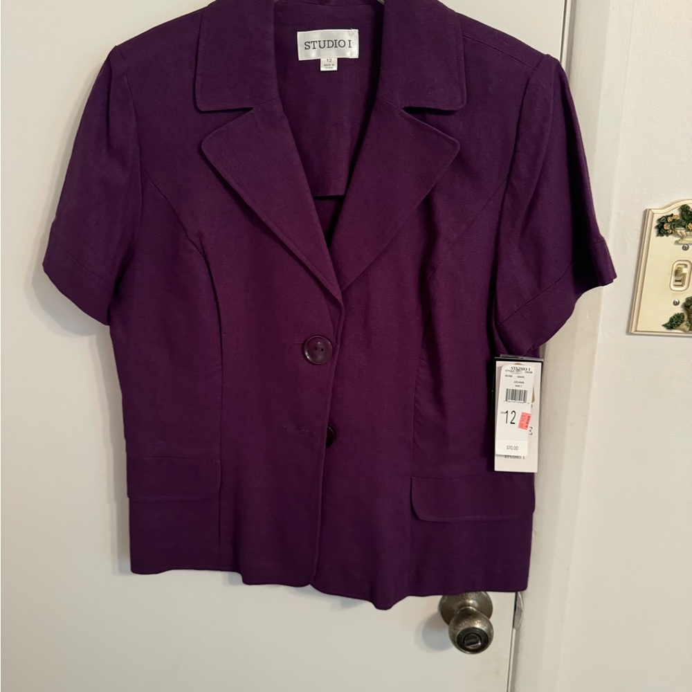 Purple jacket w/ tags still on